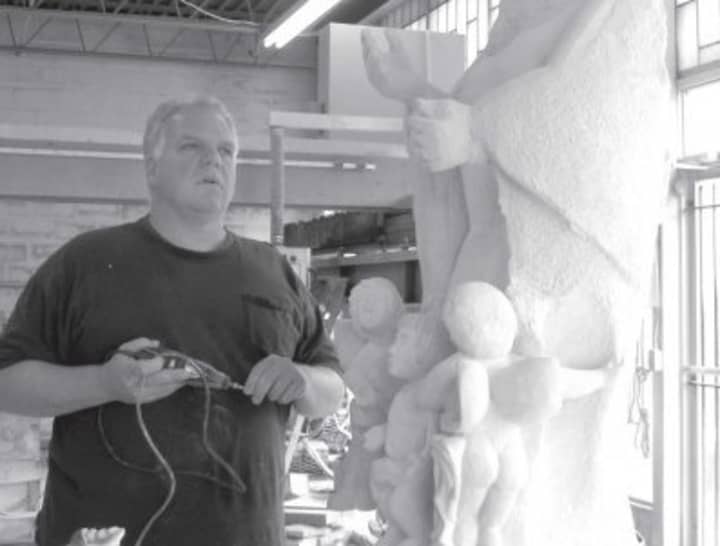 Owner, Jim Bria with unfinished sculpture the Assumption at Artista Studios and Monument Works in Bridgeport. 