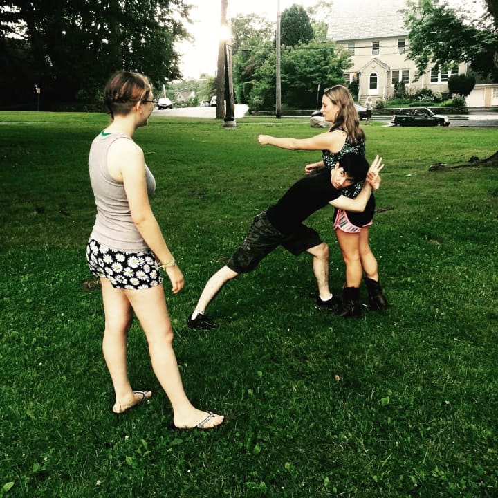 Emily Murray, of Harrison, and
Sean Michael Chin rehearse a fight scene with choreographer
Channing Porter of Rye.