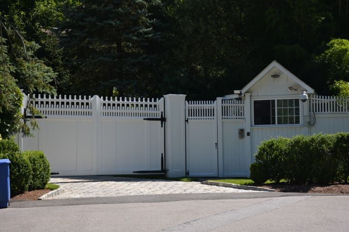 Hillary and Bill Clinton&#x27;s home in Chappaqua is buffered by an entrance gate. The entrance is pictured in 2015.