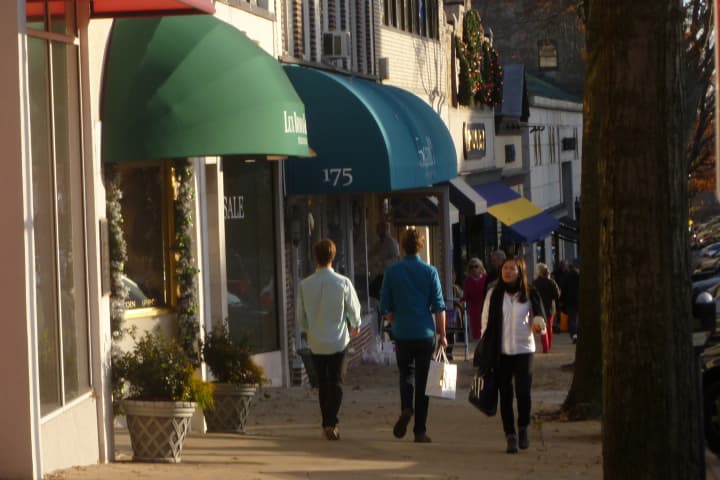 Shoppers stroll past stores on Greenwich Avenue on Wednesday afternoon.