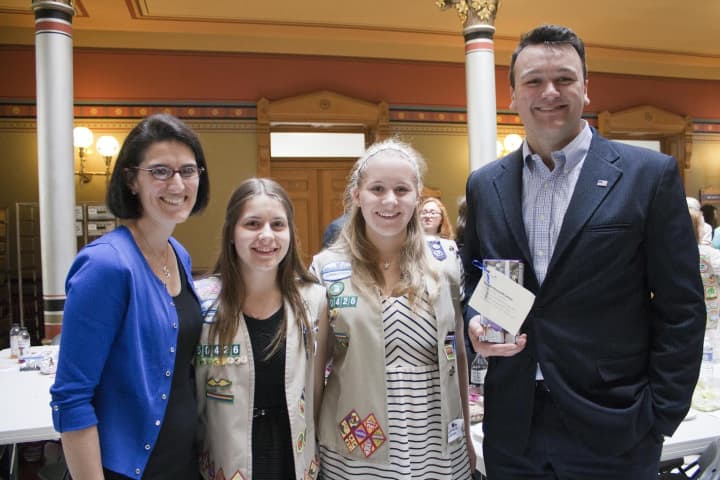 State Rep. Cristin McCarthy-Vahey, a pair of Girl Scouts and state Rep. Jesse MacLachlan. 