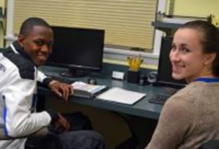 Becca Rakowitz, right, tutors Jerome Atkinson in chemistry in 2013 as part of the Beyond Limits Academic Program.