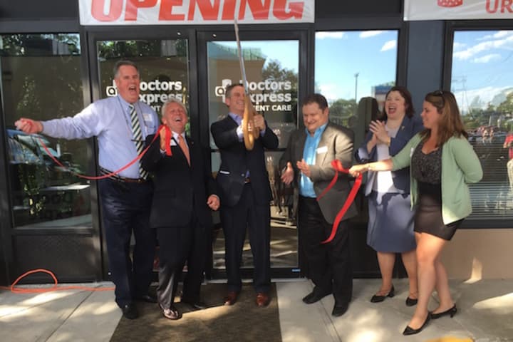 Staff from AFC/Doctors Express Urgent Care Center, as well as Norwalk Mayor Harry Rilling and Chamber of Commerce President Ed Musante cut the ribbon on the new location in Norwalk.