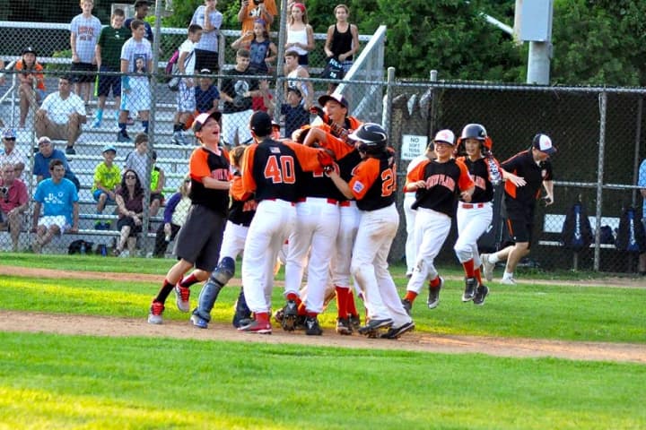 White Plains&#x27; 12 and under baseball team celebrating its Division Championship on July 16.