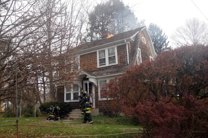 The roof of the home at 53 Washington Ave. in Westport caught fire Sunday morning. 