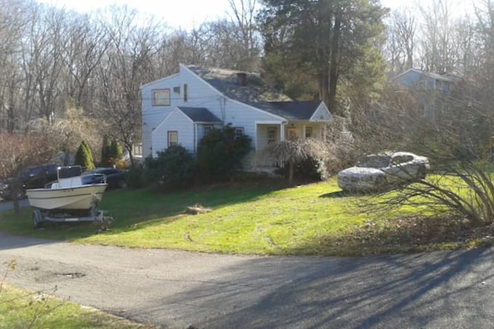 A man suffered a life-threatening gunshot wound in this home on Grumman Avenue in Wilton Monday, police said