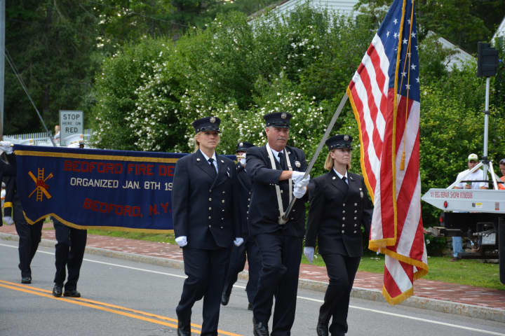 Bedford firefighters march in their parade.