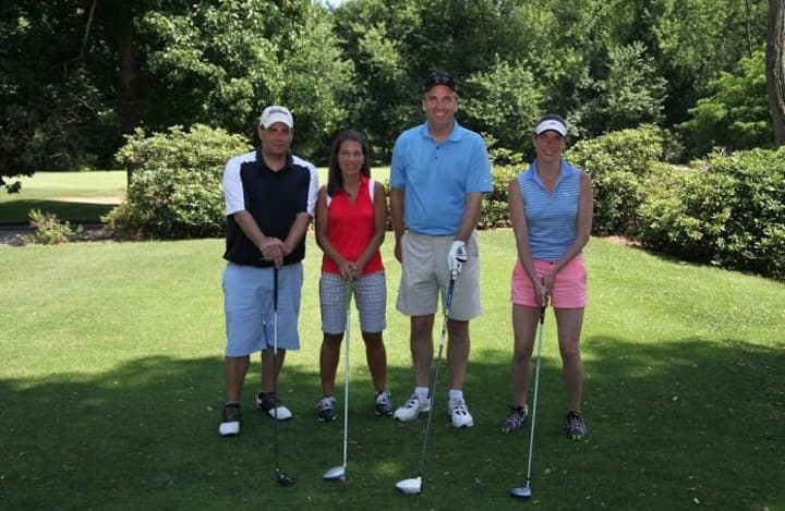 From left, Mike Testa, Janine DiCarlo, Dan Donovan, Lauren Ryan at the golf outing, which has raised more than $6 million for charity in its 28-year history.