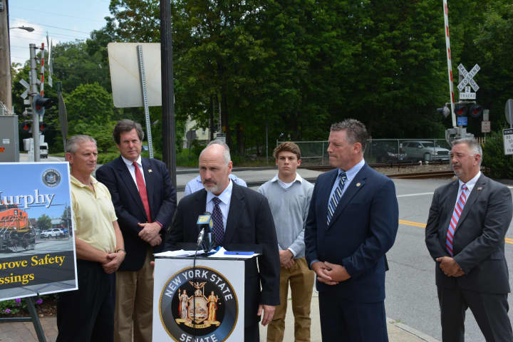 Several elected officials gathered to support cameras at railroad grade crossings.