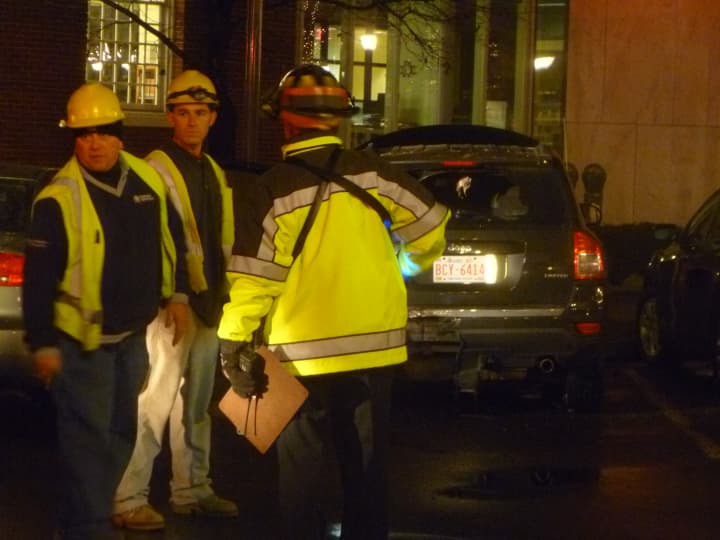 Members of Connecticut Light &amp; Power investigate the cause of a fire Tuesday night in downtown Stamford. 