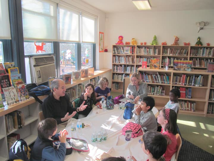 Author Peter Lerangis meets with Davis Elementary School students during a special author&#x27;s week luncheon at the New Rochelle school Wednesday.