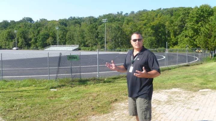 Tom Cole, Yorktown&#x27;s assistant schools superintendent for business, tours the construction site in September.