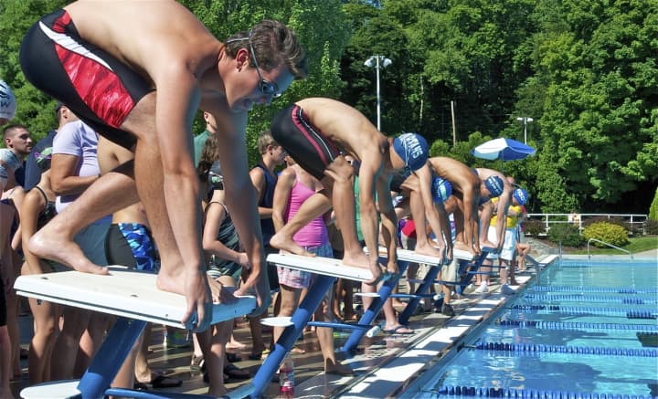 The start of the U18 boys butterfly Sunday morning at the NWSC All Star Swim Meet.