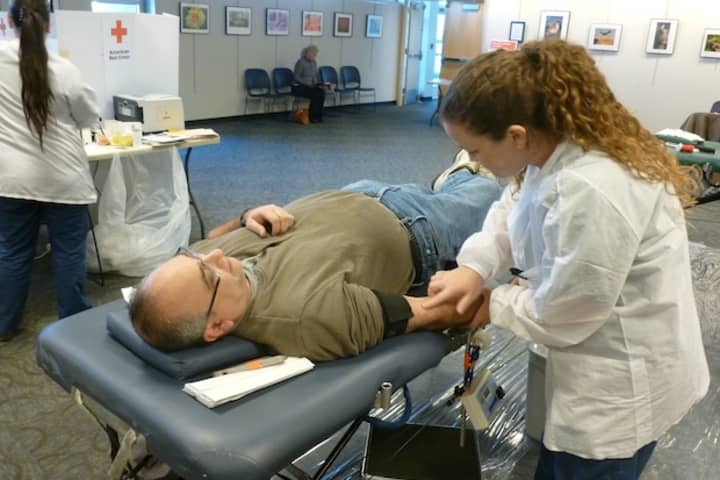 Red Cross worker Kelly Jarboe prepares Greenburgh resident Jon Marshall for a blood donation at the Greenburgh Public Library on Thursday.