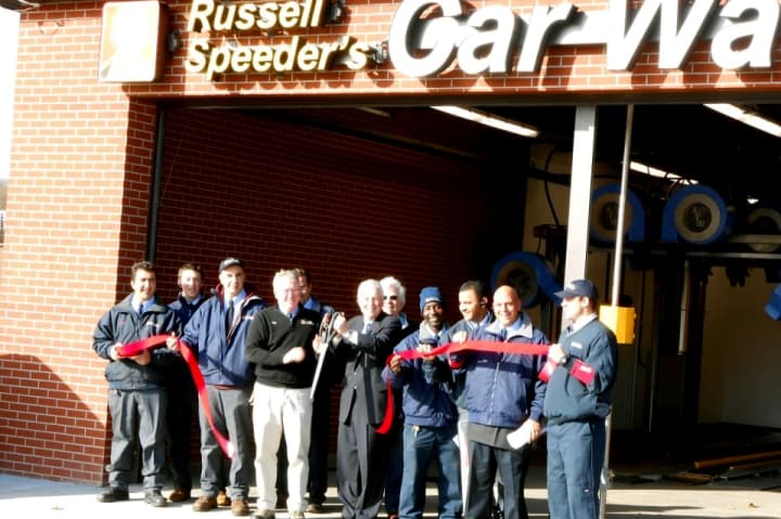 First Selectman Michael Tetreau cuts the ribbon on Russell Speeder&#x27;s Car Wash new location in Fairfield earlier this month.