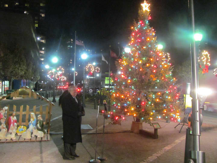 Eli Gordon, New Rochelle Chamber of Commerce executive director helps present the lights during the city&#x27;s annual holiday lighting ceremony Thursday.