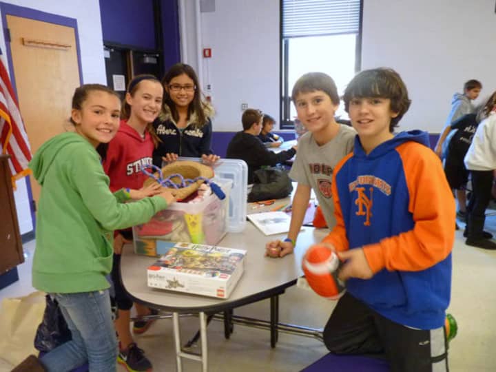 Sixth-graders at John Jay Middle School prepare packages for victims of Hurricane Sandy.