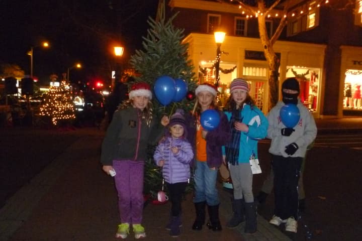 These kids happily attended the New Canaan Holiday Stroll on Friday, getting into the spirit around a Christmas tree. 