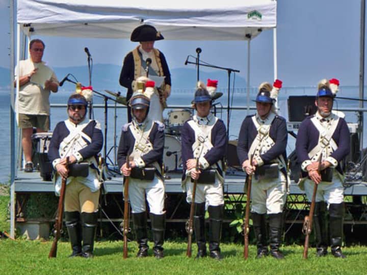 Re-enactors of the Second Continental Light Dragoons march in an earlier Dobbs Ferry Freedom Walk.