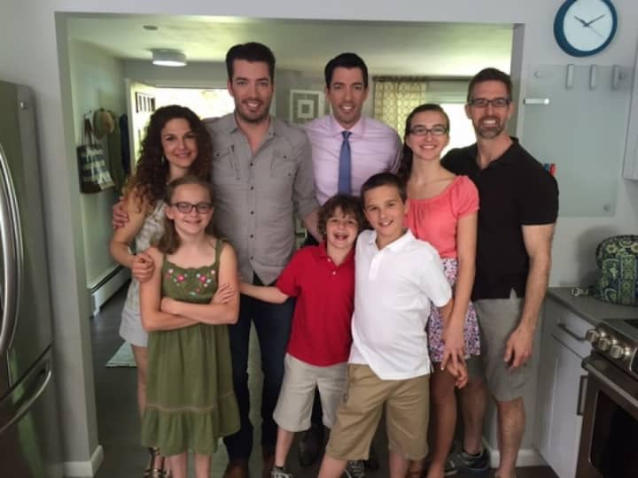 &quot;Property Brothers&quot; Jonathan and Drew Scott pose with the Royster family.