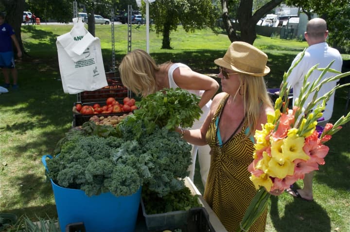 Shopping for flowers and produce at the Smith&#x27;s Acres site at the Rowayton Farmers Market.