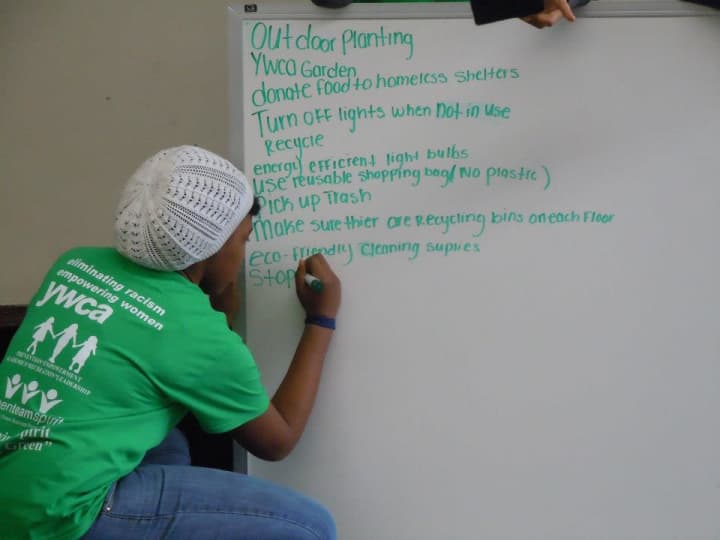 A member of the Yonkers YWCA Green Team outlines the steps to creating a more green approach at the nonprofit Saturday as part of the Green Team&#x27;s kick-off event.