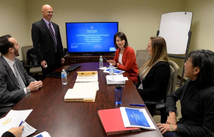 From left, students Rob Coloney; Dave Vitols; Fairfield County&#x27;s Community Foundation&#x27;s (FCCF) Elaine Mintz; student Rachel Nielsen; and FCCF board member Amy Downer.