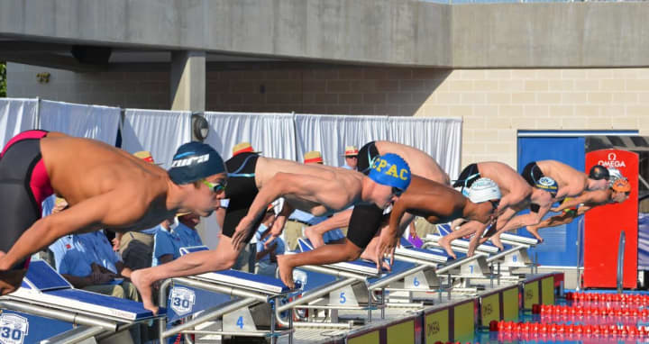 Greenwich&#x27;s Jack Montesi, center, competes for the CP-AC swim team at Chelsea Piers Connecticut in Stamford. He recently qualified for next year&#x27;s Olympic trials.