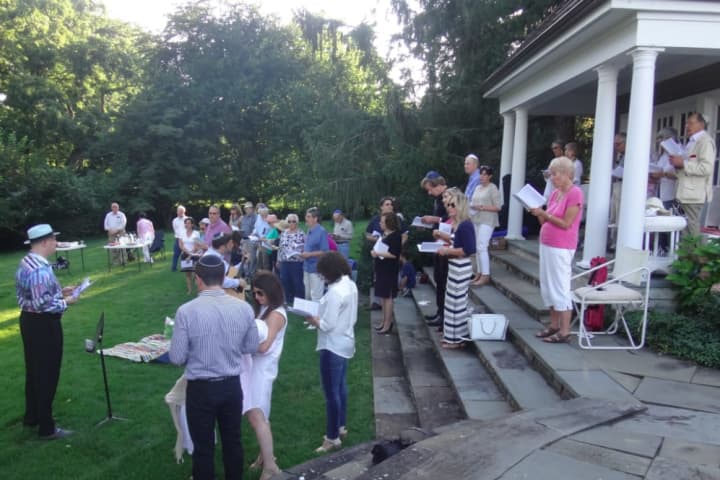 Rabbi Mitchell M. Hurvitz and Cantor Asa Fradkin of Temple Sholom led the synagogues annual beach service on Friday, August 7, 2015 at a private home overlooking Cos Cob Harbor. 