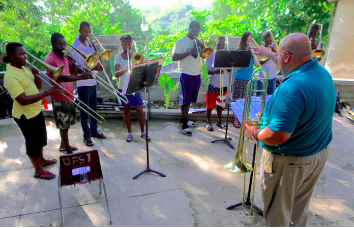 Keith Johnston, the director of bands at Sacred Heart University, recently traveled to Haiti to teach music.