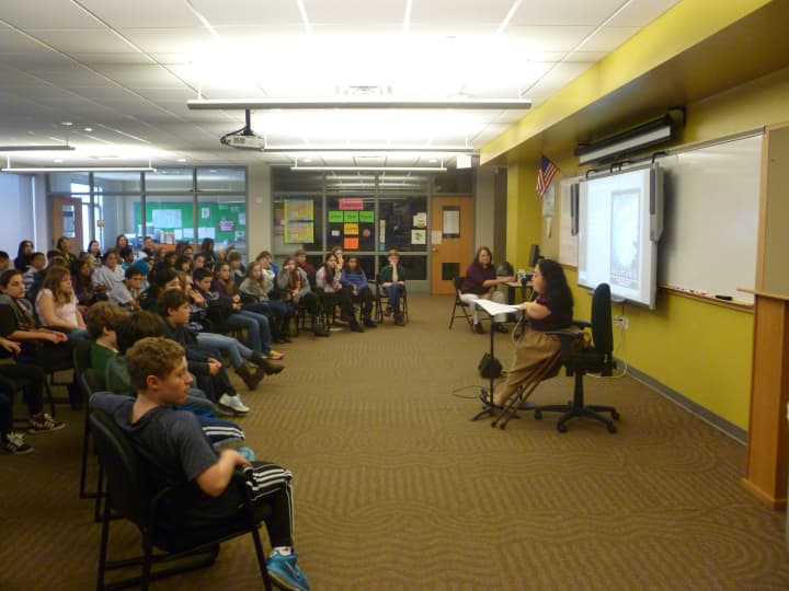 Armonk resident Geri Mariano speaks Tuesday to Seven Bridges Middle School students in Chappaqua.