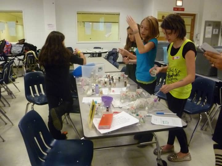 Yorktown middle school students make perfume during Tuesday&#x27;s IBM workshop.