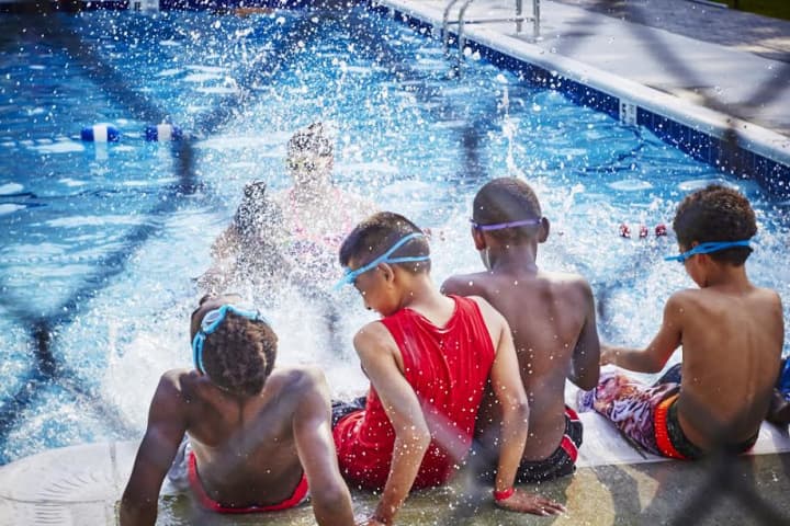 Children enjoy the pool at Camp Felix.