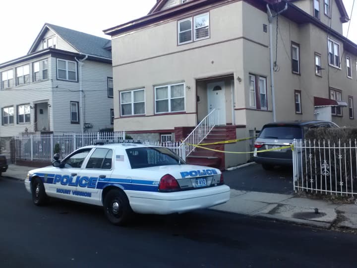 Mount Vernon Police sit Wednesday outside of 7 Berkman Ave., where a fatal stabbing occurred on Tuesday.