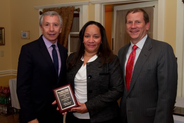 Berkeley College President Dario A. Cortes with Port Chester resident Theresa Bryant and Kevin L. Luing, chairman of the board of Berkeley College.