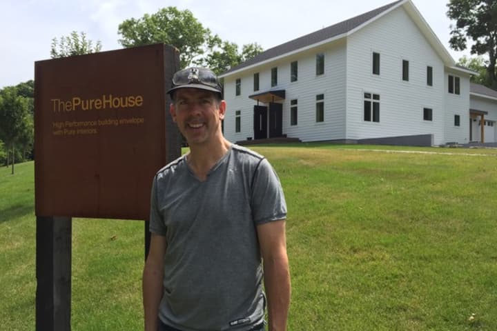 Doug Mcdonald poses in front of his Pure House on Coleytown Road in Westpor