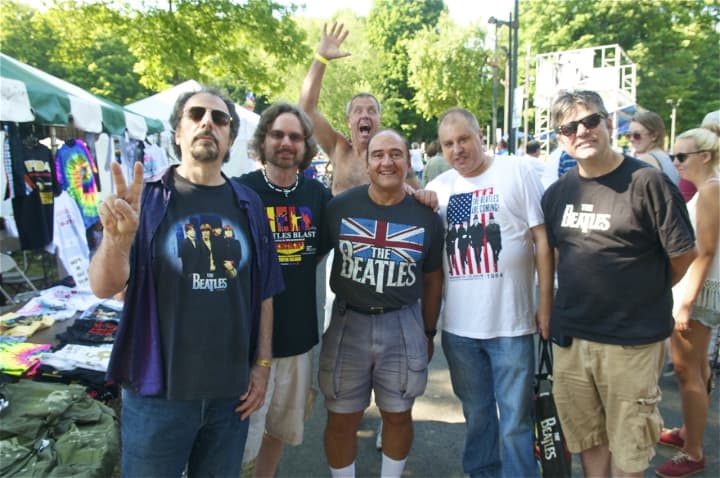 A group of Beatles fans gets photobombed by another fan at Saturday&#x27;s Fab 4 Music Festival at the Ives Center in Danbury.