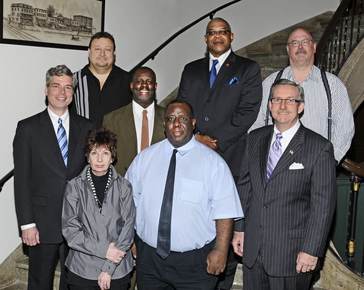 White Plains Mayor Thomas Roach, far left, presented seven of the 15 city employees who achieved 25 years of employment with the 25-Year Service Award on Monday.