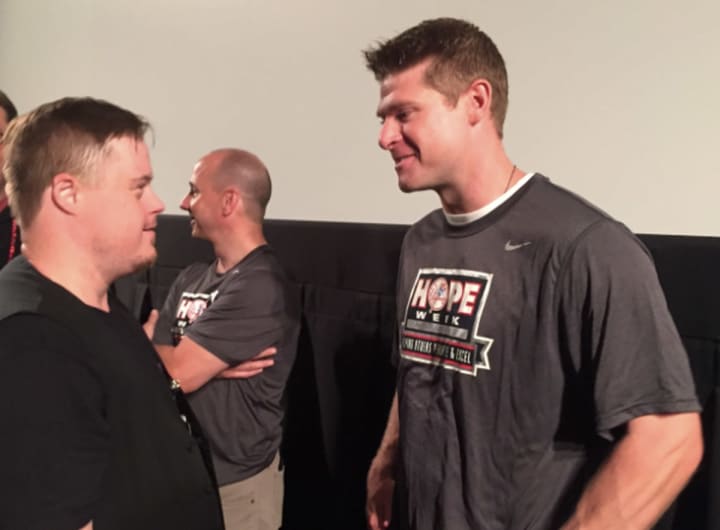Kris &quot;K-Mann&quot; Mann, a member of The Prospector Theater, discusses baseball with Yankees third baseman Chase Headley at an event Tuesday in Ridgefield. 