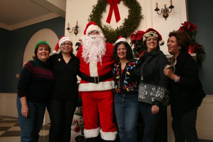 Members of the Eastchester-Tuckahoe Chamber of Commerce and Eastchester Recreation Department posed with Santa on Saturday.