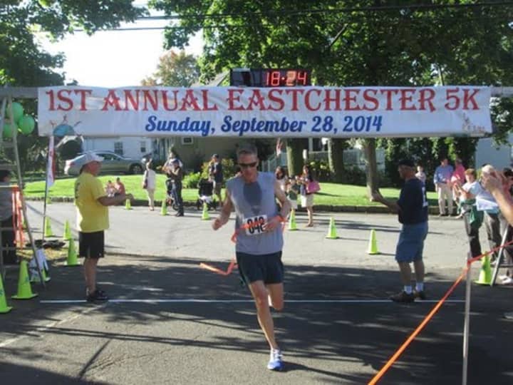 Michael Nobles, winner of last year&#x27;s Eastchester 5K Race, crosses the finish line