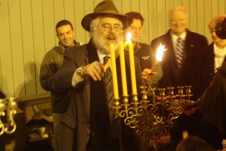 Rabbi Yehoshua Hecht of Beth Israel of Westport and Norwalk lights the Menorah at a previous Stew Leonard&#x27;s Community Menorah Lighting Celebration.