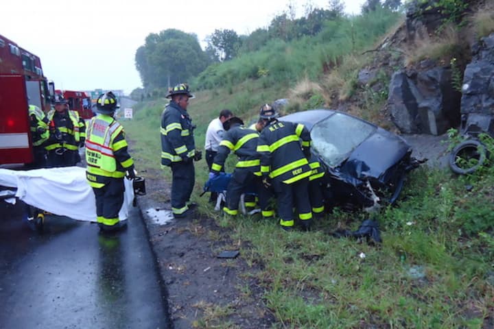 A car rolled over and hit a rock wall on I-95 north in Norwalk Friday morning.