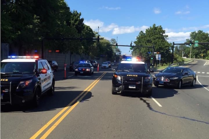 Police close off West Avenue Friday afternoon after a person fell from the I-95 bridge.