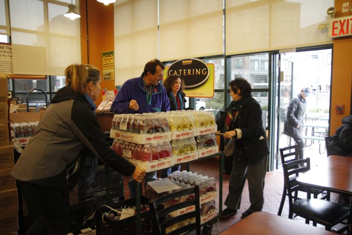 Community Plates volunteers load up food at a Fairway Market to be delivered to a food pantry.