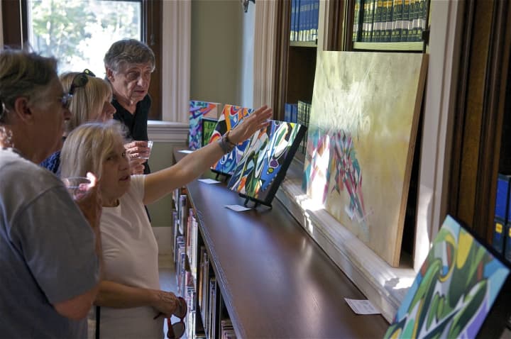 Visitors discuss art at Ridgefield&#x27;s Art Walk.