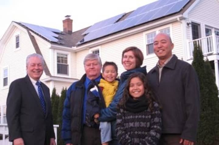 Fairfield&#x27;s Lein family, Patrick, Wendy, Miranda and Max, show off their new solar panels with Public Works Assistant. Director Ed Boman and First Selectman Michael Tetreau. 