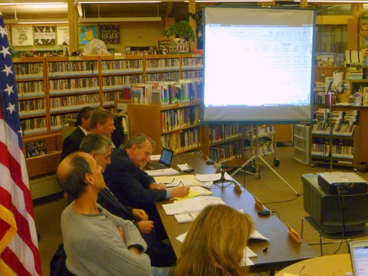The Lewisboro Town Board reviews the 2013 budget Monday night before voting to approve it.