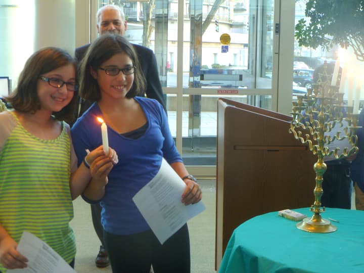 Several kids from Temple Beth El in Stamford help the city celebrate Hanukkah. 