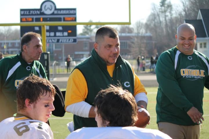 Trinity Catholic coach Pete Stokes talks to his team before a game against Wilton in November. 